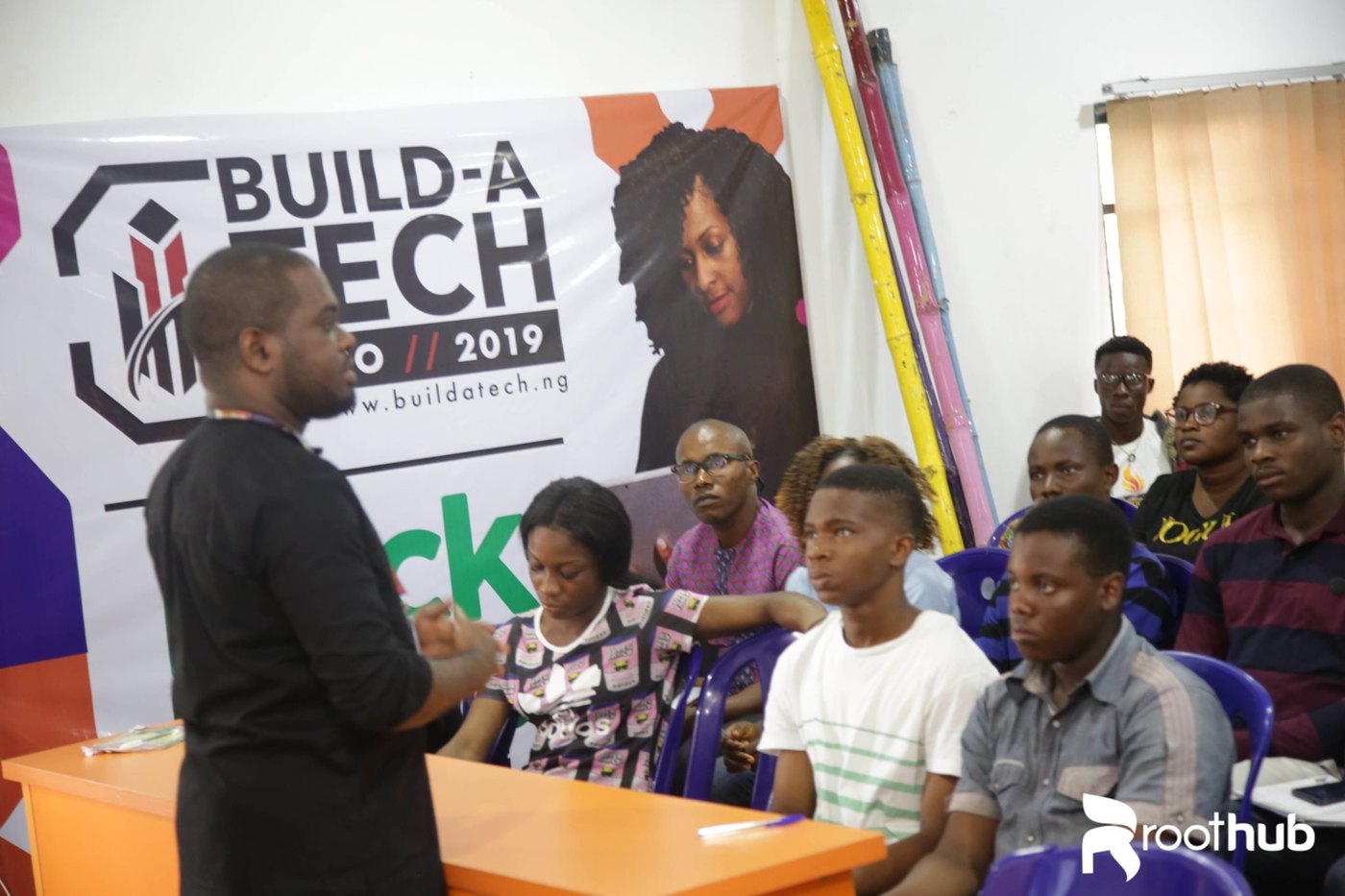 A facilitator teaching Roothub Tech101 trainees during a digital skills session